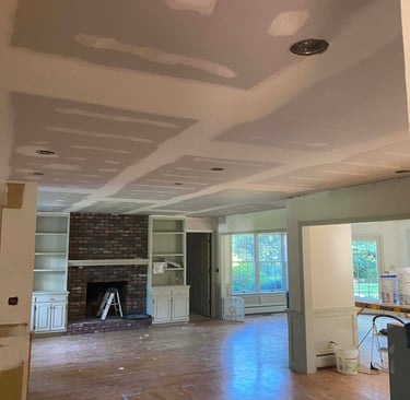 drywall installed by drywall contractor on the ceiling over popcorn