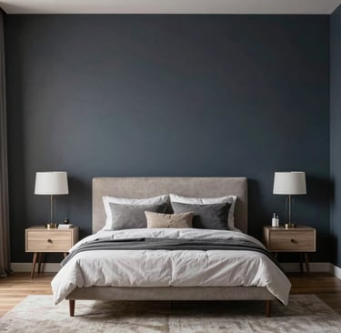 A dark modern bedroom featuring navy and charcoal walls, complemented by Light-colored. 
