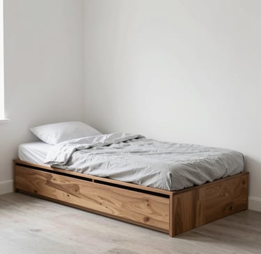 A small bedroom with a storage bed and minimal furniture arranged for maximum space