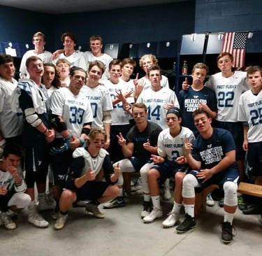 First Flight lacrosse players in locker room, 2017.