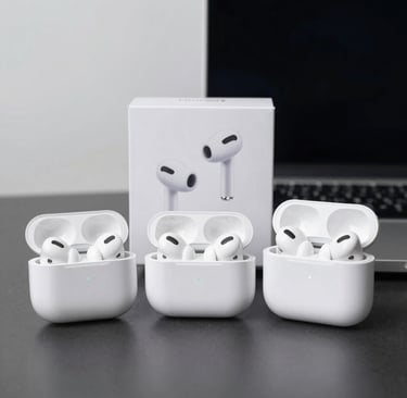 Pair of white AirPods resting on a smooth black tech mat with subtle lighting