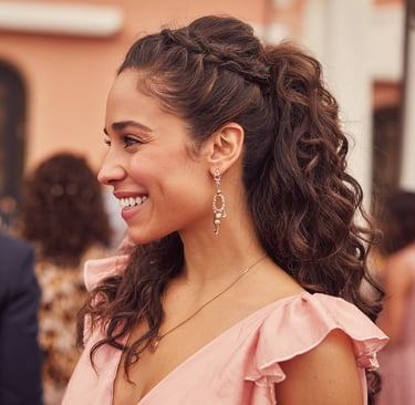 Half up half down wedding guest hairstyle soft curls