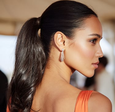 Sleek ponytail wedding guest hairstyle modern elegant