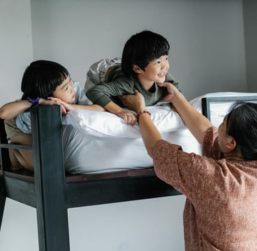 a mother is helping a young child with a bunk bed