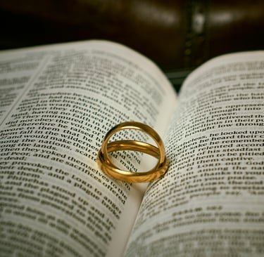 wedding rings of a married couple on a bible