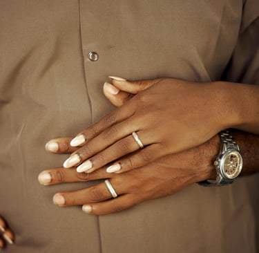 a man and woman holding hands on their hands