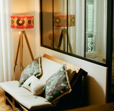 a couch with pillows and pillows in a room