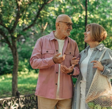 married couple walking home after grocery shopping