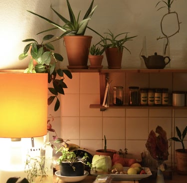 a kitchen with a lamp and a lamp on a counter