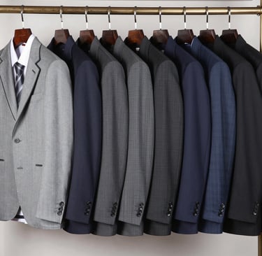 Close-up of white and orange polythene covers snugly enclosing laundered local African attires.