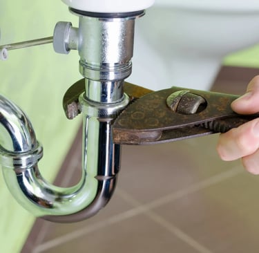 a handyman fixing a pipe in Vancouver bc