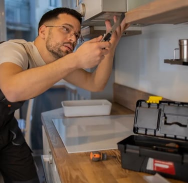 handyman fixing oven in squamish