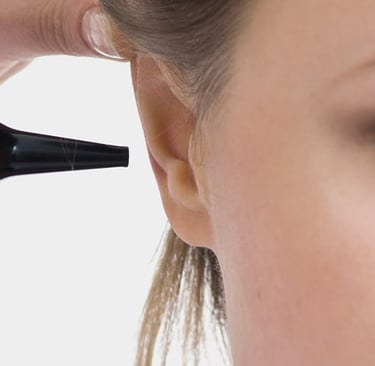 A doctor Porro performing an ear examination on a patient using a professional medical otoscope.