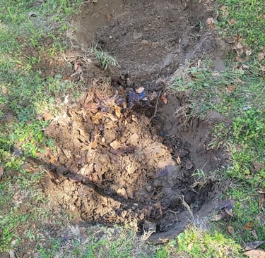 digging out the hole to place the pans