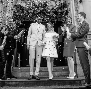 wedding couple walking down the stairs of Chelsea old town hall