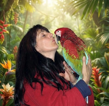 A woman kisses a colorful red-and-green macaw parrot in a tropical jungle setting.