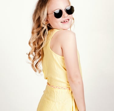portrait of a young girl wearing sunglasses and sunglasses