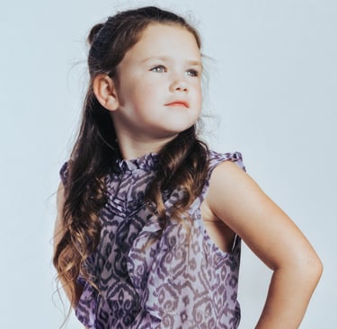 portrait of a young girl in a purple dress with a purple dress