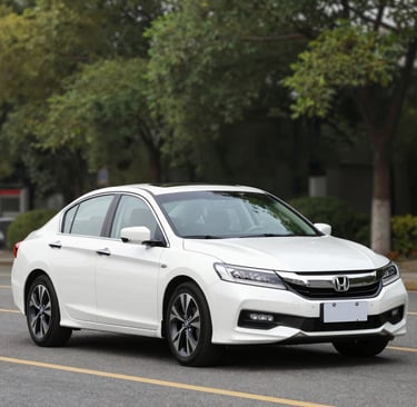 Compact economy car parked along a city street, ready for daily errands or deliveries.