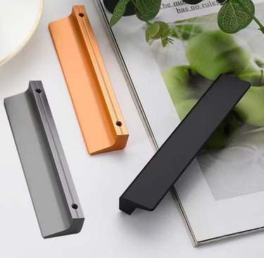 Set of modern cabinet door handles in black, gray, and copper metallic finishes for kitchen or furniture hardware