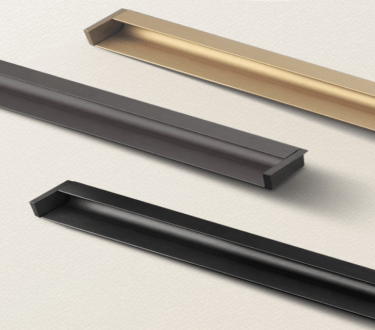 Champagne gold aluminum L-shape groove pull handle installed on a light oak kitchen drawer, showcasing 