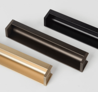 aluminum L-shape groove pull handle installed in a light oak wood cabinet, showcasing seamless flush slot-in design