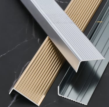 Aluminum metal floor transition strips in gold, silver and gray colors for interior flooring decoration
