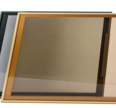 Two modern glass serving trays with metal frames - one in gold and one in black, ideal for home decor and entertaining