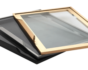Framed tinted glass panels (gold/black frames) – decorative glass inserts for cabinet doors or partitions.