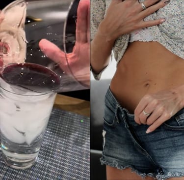 a woman in a short skirt and a glass of wine