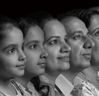Black and white multi-generational family portrait showing three generations in profile.