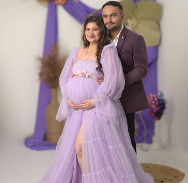 Expectant parents sharing a moment during a professional maternity studio session