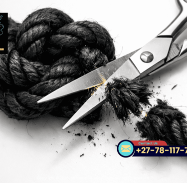 Sharp silver scissors cutting through a thick black knotted rope representing spiritual ritual and breaking ties.