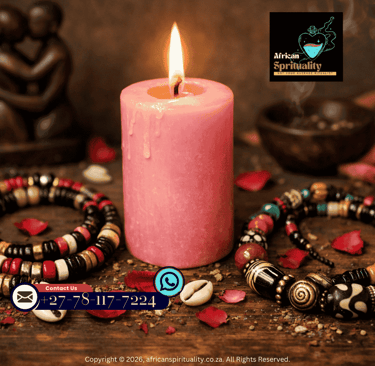 A glowing pink candle with African spiritual beads, rose petals, and a lovers figurine for ritual work.