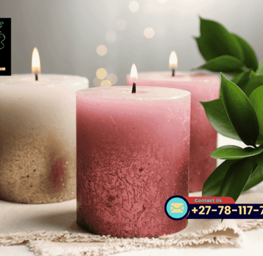 Lit pink and white pillar candles for African spirituality rituals and meditation.