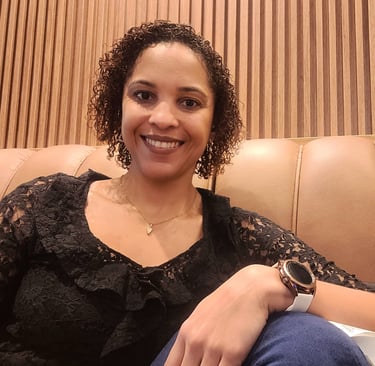 a woman sitting on a couch with a watch on her wrist