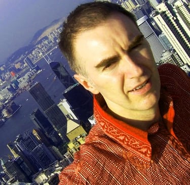 Karl Drury in Hong Kong: Karl photographed in Hong Kong in 2007 with the city skyline during an extended stay in Asia