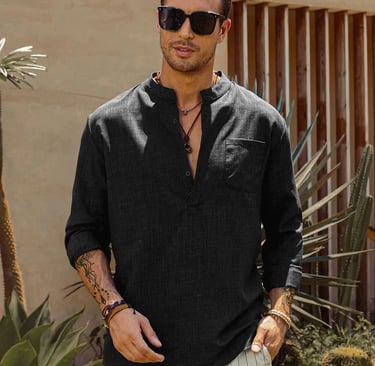 a man in a long sleeve black shirt and white pants