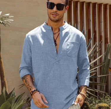 a man in a sky blue shirt and white pants