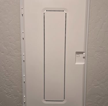White Legrand structured media enclosure cover mounted on a textured wall for organized home networking.