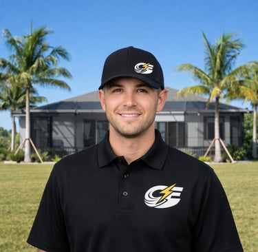 Caloosa Electric electrician smiling in uniform outside a modern Southwest Florida Home