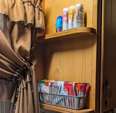 drink packets lined up & organized neatly by a sink