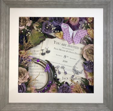 memory box full of jewellery, wedding items and preserved wedding bouquet flowers in a deep frame