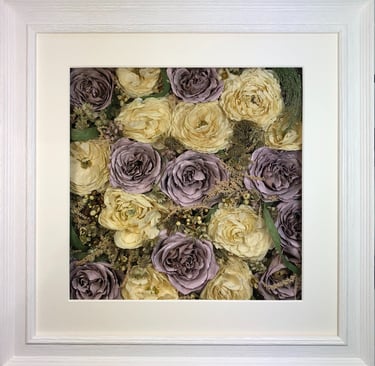 an ivory and lilac flower wall style preserved wedding bouquet in a frame