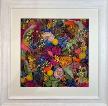 a beautiful bright flower wall style preserved wedding bouquet in a frame