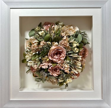 Birdseye view preserved wedding bouquet in a thick white frame