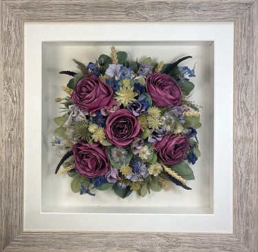 Magenta and lilac Birdseye view preserved wedding bouquet in a frame