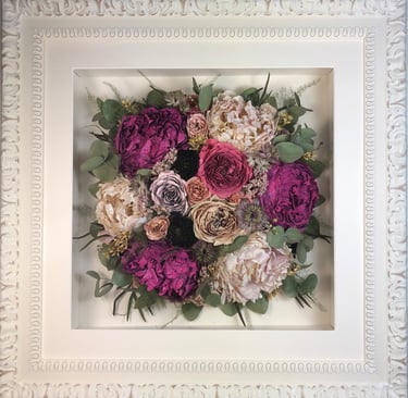 Birdseye view preserved wedding bouquet in a frame with large peonies