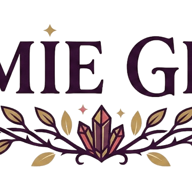 Jamie Grey logo with dark purple serif text above a decorative vine with crystals, leaves, and moon icons.