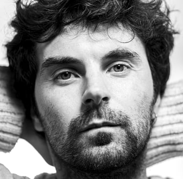 a man with a beard and a sweater on